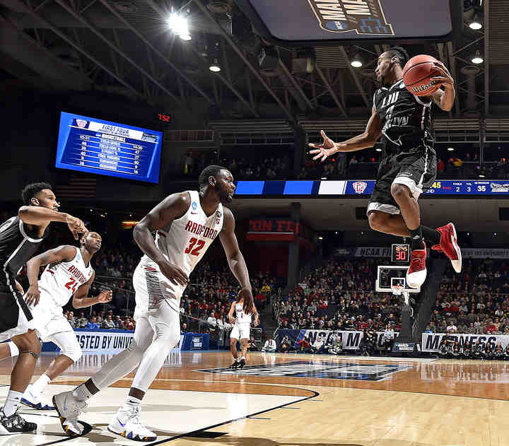 LIU Brooklyn's Jashaun Agosto grabs a big rebound during the 2nd half of action against Radford in the NCAA First Four game hosted by the University of Dayton. Radford defeated LIU 71-61   (Erik Schelkun / Elsestar Images)